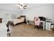Spacious bedroom features a ceiling fan and a large window providing ample natural light at 8350 40Th N Ave, St Petersburg, FL 33709