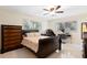 Well-lit bedroom with tile floors, ceiling fan, and a comfortable bed with ample closet space at 8350 40Th N Ave, St Petersburg, FL 33709