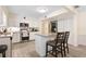 Well-lit kitchen with white cabinets, stainless steel appliances, and a central island with seating at 8350 40Th N Ave, St Petersburg, FL 33709