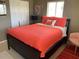 Bright bedroom with a colorful bedspread, closet, and minimalist decor at 8455 112Th St # 212, Seminole, FL 33772