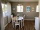 Cozy dining area with natural light, wood flooring, and a charming table setup at 8455 112Th St # 212, Seminole, FL 33772