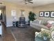 Comfortable living room featuring a plush sofa, recliner, and decorative accents at 8455 112Th St # 212, Seminole, FL 33772