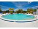 Large community pool with clear, inviting water, surrounded by lounge chairs and lush landscaping at 8455 112Th St # 212, Seminole, FL 33772