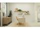 Bright, comfortable office featuring a computer, modern shelves and décor with view to outside at 9554 Minnow Ray Dr, Land O Lakes, FL 34638