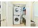 Convenient indoor laundry room with newer stacked washer and dryer at 9802 N Oregon Ave, Tampa, FL 33612