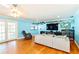 Comfortable living room featuring hardwood floors and neutral-toned decor at 9802 N Oregon Ave, Tampa, FL 33612