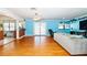 Spacious living room with hardwood floors and a view of the kitchen at 9802 N Oregon Ave, Tampa, FL 33612