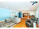 Open concept living room featuring hardwood floors and neutral-toned decor at 9802 N Oregon Ave, Tampa, FL 33612