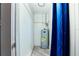A utility room featuring a water heater and storage space at 9802 N Oregon Ave, Tampa, FL 33612