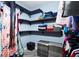 A walk-in closet with wrapped shelving provides ample storage for clothes, shoes and accessories at 9802 N Oregon Ave, Tampa, FL 33612