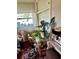 Cluttered bedroom with wood floors, plants, and clothing storage at 10980 104Th Ave, Largo, FL 33778