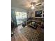 Bright living room with sliding glass doors leading to outdoor patio, providing ample natural light at 10980 104Th Ave, Largo, FL 33778