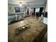 Open-concept living room with modern decor, hardwood flooring, and comfortable seating arrangement at 10980 104Th Ave, Largo, FL 33778