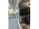 Indoor/outdoor living with patio area and living room with cozy sectional sofa at 10980 104Th Ave, Largo, FL 33778