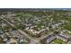 An aerial view of a condo community situated among lush green spaces and a nearby golf course at 12900 Vonn Rd # D202, Largo, FL 33774