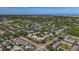 A picturesque aerial view of a vibrant condo community with lush landscaping and nearby amenities at 12900 Vonn Rd # D202, Largo, FL 33774
