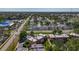 An aerial perspective of apartment buildings amidst tree-lined streets in a vibrant neighborhood at 12900 Vonn Rd # D202, Largo, FL 33774