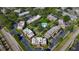 An aerial shot of a beautiful condo community boasting a pool and beautifully maintained grounds at 12900 Vonn Rd # D202, Largo, FL 33774