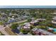 Aerial shot of a residential area showcasing well-maintained apartment buildings surrounded by lush greenery at 12900 Vonn Rd # D202, Largo, FL 33774