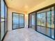 Balcony featuring tile flooring with access to other rooms at 12900 Vonn Rd # D202, Largo, FL 33774