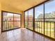 Screened balcony overlooking green space at 12900 Vonn Rd # D202, Largo, FL 33774