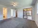 Large bedroom featuring carpet floors and access to various rooms at 12900 Vonn Rd # D202, Largo, FL 33774