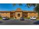 Exterior of the condo building with well-maintained landscaping and dedicated parking spaces at 12900 Vonn Rd # D202, Largo, FL 33774
