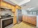 Updated kitchen with stainless steel appliances, granite counters, and convenient layout at 12900 Vonn Rd # D202, Largo, FL 33774