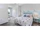 Playful bedroom with cloud-themed wallpaper, colorful accents, and white furniture with decorative lamps at 17273 Bigleaf Mahogany Ln, Land O Lakes, FL 34638