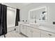 Modern bathroom with large mirror, white cabinets, and shower at 175 S 2Nd S St # Ph-16, St Petersburg, FL 33701