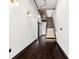 Hallway with stairs and dark hardwood floors at 175 S 2Nd S St # Ph-16, St Petersburg, FL 33701