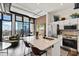 Modern kitchen with stainless steel appliances, marble countertops, exposed brick and floor-to-ceiling windows offering city views at 175 S 2Nd S St # Ph-16, St Petersburg, FL 33701
