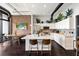 Contemporary kitchen featuring a center island, white cabinets, stainless steel appliances, and sleek hardwood floors at 175 S 2Nd S St # Ph-16, St Petersburg, FL 33701