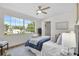 Sunlit bedroom features a large window and ample closet space for comfortable living at 1948 Citrus Hill Ln, Palm Harbor, FL 34683