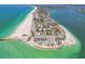 Breathtaking aerial view capturing peninsula with beachfront condos and residential streets at 200 1St Ave # 309, St Pete Beach, FL 33706