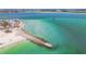 Beautiful aerial view of ocean front property near the beach with stunning turquoise waters at 200 1St Ave # 309, St Pete Beach, FL 33706