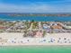 Coastal aerial showing a resort town on the Gulf Coast with a beach, shops, and restaurants at 200 1St Ave # 309, St Pete Beach, FL 33706