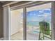 Balcony showcasing a pool and water view, perfect for relaxing and enjoying the scenery at 200 1St Ave # 309, St Pete Beach, FL 33706