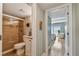 Well-lit bathroom featuring a tiled shower, modern fixtures, and access to the bedroom at 200 1St Ave # 309, St Pete Beach, FL 33706