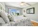 Bright bedroom featuring a starfish themed comforter and beautiful water views at 200 1St Ave # 309, St Pete Beach, FL 33706