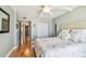 Bedroom with hardwood floors, a ceiling fan, and closet, offering a cozy and inviting space at 200 1St Ave # 309, St Pete Beach, FL 33706