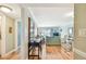Spacious living room featuring hardwood floors, comfortable seating, and a sliding glass door to the balcony at 200 1St Ave # 309, St Pete Beach, FL 33706