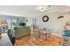 Comfortable living room with water views from the sliding glass door and hardwood floors at 200 1St Ave # 309, St Pete Beach, FL 33706