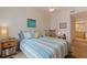 Inviting bedroom with comfortable bedding, rocking chair, and warm ambiance at 200 4Th S Ave # 220, St Petersburg, FL 33701