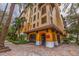 Condo entrance with arched entryway, decorative columns, and attractive landscaping at 200 4Th S Ave # 220, St Petersburg, FL 33701