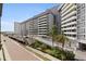 Modern apartment building with parking and lush landscaping at 200 4Th S Ave # 220, St Petersburg, FL 33701