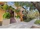 A condo's exterior shows a private entry with lush landscaping, colorful tiles, and beautiful curb appeal at 200 4Th S Ave # 220, St Petersburg, FL 33701