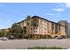 Inviting multi-story condo building featuring balconies, palm trees, and well-maintained landscaping at 200 4Th S Ave # 220, St Petersburg, FL 33701