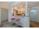View of kitchen bar with red stools, and modern appliances at 200 4Th S Ave # 220, St Petersburg, FL 33701