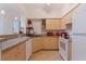 Kitchen with stainless steel appliances, tile floors, and laminate cabinets at 200 4Th S Ave # 220, St Petersburg, FL 33701